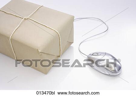 Stock Image - still life of parcel and computer mouse. Fotosearch