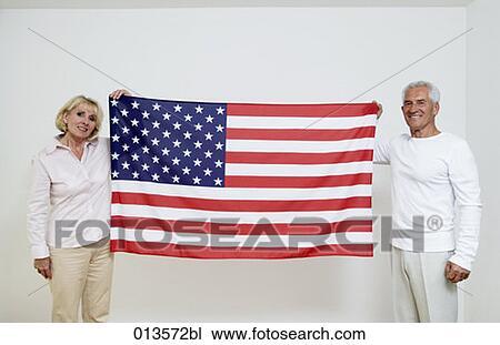 two mature people showing Stars and Stripes View Large Photo Image Stock Image - two mature people showing Stars and Stripes. Fotosearch