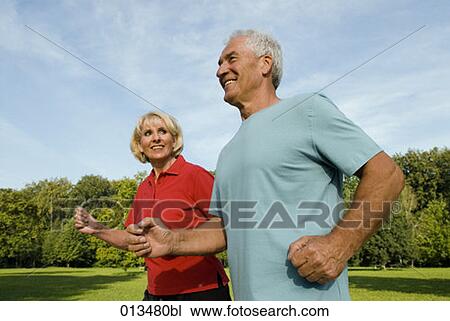 woman looking at man while running through park View Large Photo Image Stock Image - woman looking at man while running through park. Fotosearch