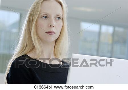 woman on computer whith thoughtful expression View Large Photo Image Stock Image - woman on computer whith thoughtful expression. Fotosearch