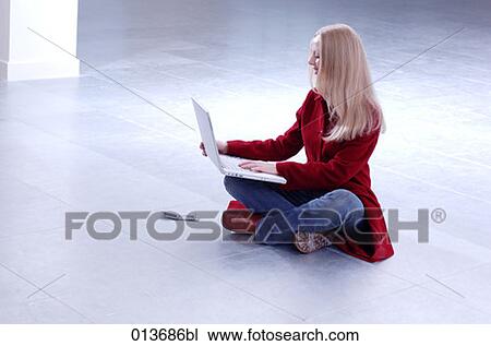 young businesswoman working with laptop in empty office space View Large Photo Image Stock Image - young businesswoman working with laptop in empty office space. Fotosearch