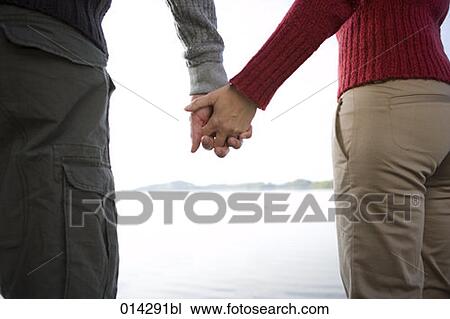 young couple holding hands View Large Photo Image Stock Image - young couple holding hands. Fotosearch