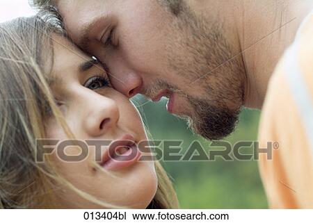 young couple sharing a tender moment View Large Photo Image Stock Image - young couple sharing a tender moment. Fotosearch