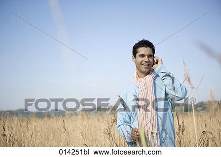 young man having telephone conversation in autumn View Large Photo Image Stock Image - young man having telephone conversation in autumn. Fotosearch