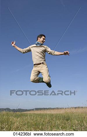 young man jumping in the air View Large Photo Image Stock Image - young man jumping in the air. Fotosearch