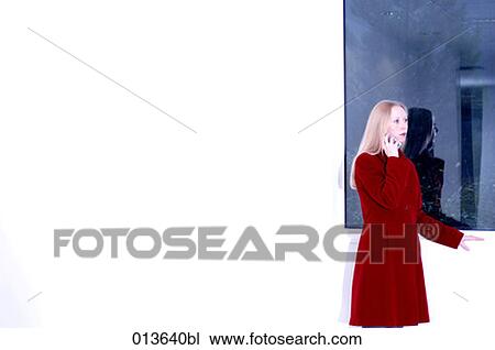 young woman in red coat having telephone conversation View Large Photo Image Stock Image - young woman in red coat having telephone conversation. Fotosearch