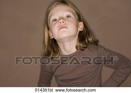 arrogant looking little girl in brown sweater View Large Photo Image Stock Image - arrogant looking little girl in brown sweater. Fotosearch
