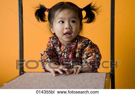 asian girl seen through shelf View Large Photo Image Stock Image - asian girl seen through shelf. Fotosearch