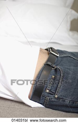 belly of man lying on his bed View Large Photo Image Stock Image - belly of man lying on his bed. Fotosearch
