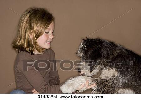 blonde girl playing with pet dog View Large Photo Image Stock Image - blonde girl playing with pet dog. Fotosearch