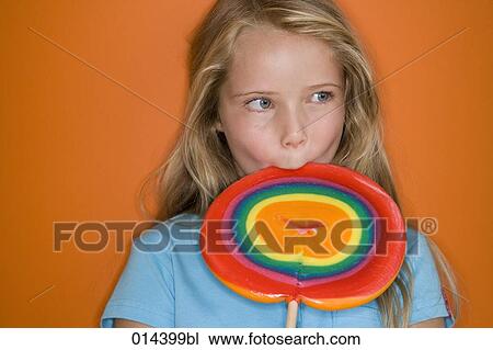 blonde girl tasting colourful lollipop View Large Photo Image Stock Image - blonde girl tasting colourful lollipop. Fotosearch