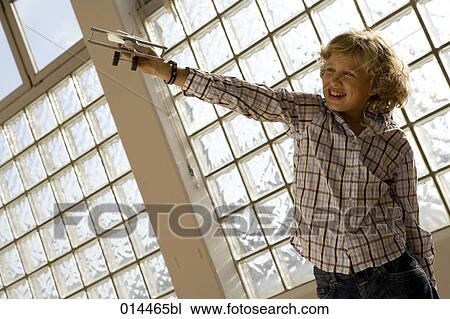 boy enjoying play with airplane at home View Large Photo Image Stock Image - boy enjoying play with airplane at home. Fotosearch