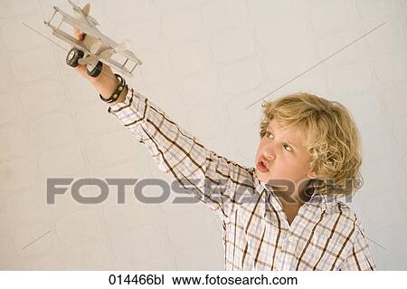 boy playing with toy plane View Large Photo Image Stock Image - boy playing with toy plane. Fotosearch