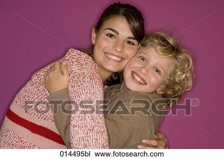 Stock Image - brother and sister embracing. Fotosearch