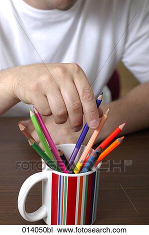 close-up of man choosing blue pencil from cup View Large Photo Image Stock Image - close-up of man choosing blue pencil from cup. Fotosearch