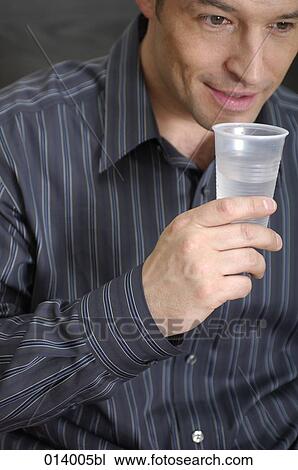 close-up of man drinking some water View Large Photo Image Stock Image - close-up of man drinking some water. Fotosearch