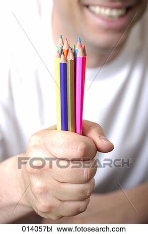 close-up of man holding many colourful pencils in hand View Large Photo Image Stock Image - close-up of man holding many colourful pencils in hand. Fotosearch