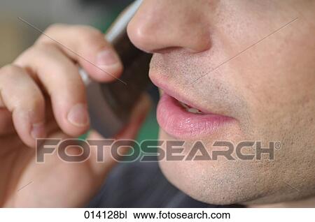 close-up of mouth of young man with cellphone View Large Photo Image Stock Image - close-up of mouth of young man with cellphone. Fotosearch