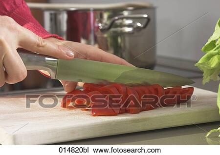close-up of woman cutting red pepper View Large Photo Image Stock Image - close-up of woman cutting red pepper. Fotosearch