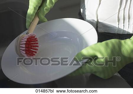close-up of woman washing up wearing rubber gloves View Large Photo Image Stock Image - close-up of woman washing up wearing rubber gloves. Fotosearch
