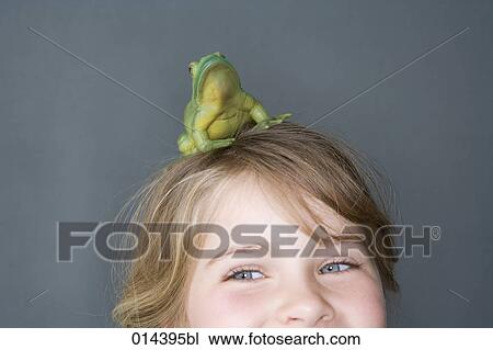 cropped portrait of girl with frog on head View Large Photo Image Stock Image - cropped portrait of girl with frog on head. Fotosearch