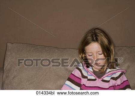 depressed girl sitting at home on sofa View Large Photo Image Stock Image - depressed girl sitting at home on sofa. Fotosearch