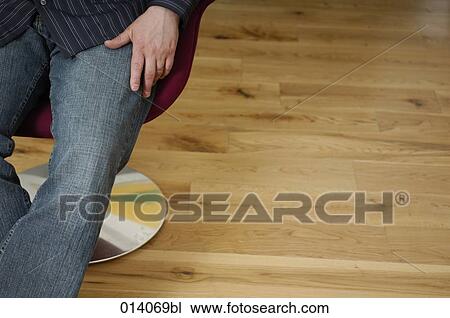 detail of man sitting in lounge chair on parquet View Large Photo Image Stock Image - detail of man sitting in lounge chair on parquet. Fotosearch