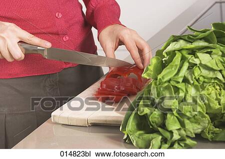 detail of woman preparing salad, cutting red pepper View Large Photo Image Stock Image - detail of woman preparing salad, cutting red pepper. Fotosearch