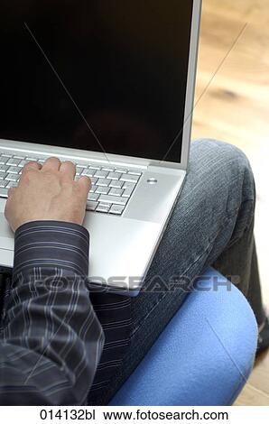 detail of young man with notebook computer View Large Photo Image Stock Image - detail of young man with notebook computer. Fotosearch