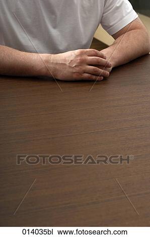 hands of man sitting at table View Large Photo Image Stock Image - hands of man sitting at table. Fotosearch
