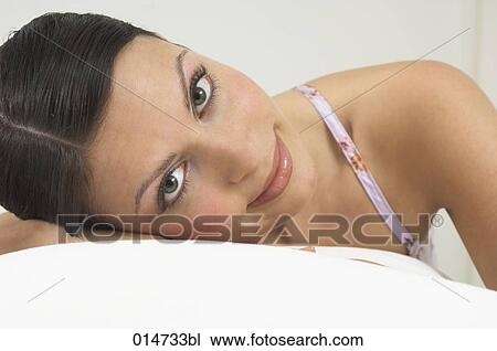 headshot of beautiful young woman looking at camera View Large Photo Image Stock Image - headshot of beautiful young woman looking at camera. Fotosearch