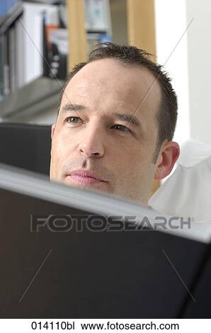 headshot of young man reading book View Large Photo Image Stock Image - headshot of young man reading book. Fotosearch