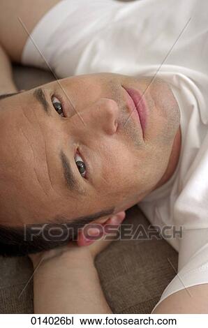 headshot of young man relaxing View Large Photo Image Stock Image - headshot of young man relaxing. Fotosearch