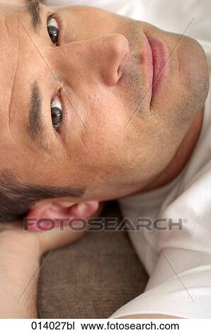 headshot of young man relaxing View Large Photo Image Stock Image - headshot of young man relaxing. Fotosearch