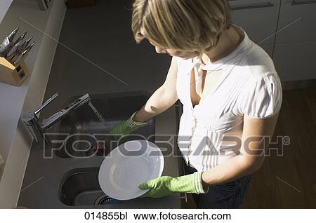 high angle view of young woman washing up View Large Photo Image Stock Image - high angle view of young woman washing up. Fotosearch