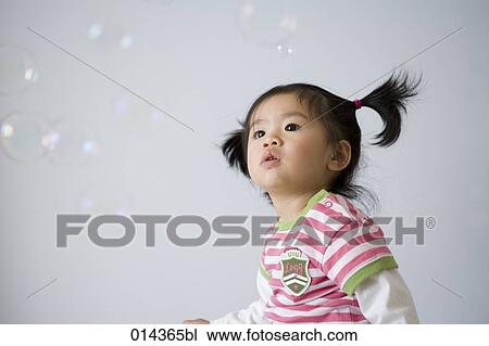 little asian toddler looking at soap bubbles View Large Photo Image Stock Image - little asian toddler looking at soap bubbles. Fotosearch