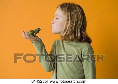 little girl about to kiss a frog View Large Photo Image Stock Image - little girl about to kiss a frog. Fotosearch
