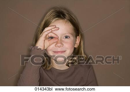 little girl making focus gesture to her eye View Large Photo Image Stock Image - little girl making focus gesture to her eye. Fotosearch