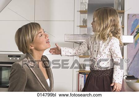 little girl trying to beat her mother View Large Photo Image Stock Image - little girl trying to beat her mother. Fotosearch