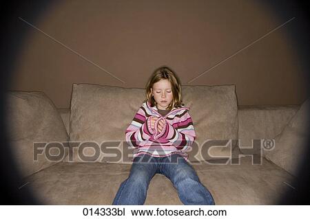 lonely girl sitting on sofa View Large Photo Image Stock Image - lonely girl sitting on sofa. Fotosearch