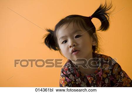low angle view of curious looking asian baby View Large Photo Image Stock Image - low angle view of curious looking asian baby. Fotosearch