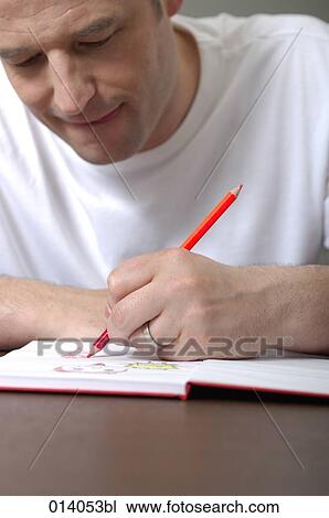 man drawing in book View Large Photo Image Stock Image - man drawing in book. Fotosearch