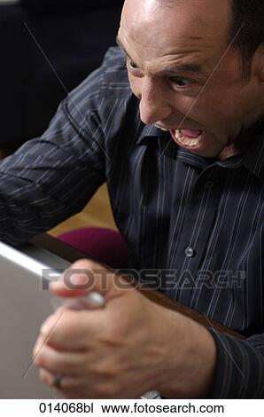 man shouting at computer screen View Large Photo Image Stock Image - man shouting at computer screen. Fotosearch