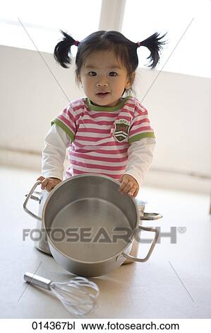 portrait of asian baby playing with saucepan View Large Photo Image Stock Image - portrait of asian baby playing with saucepan. Fotosearch