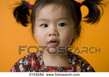 portrait of asian baby with pigtails View Large Photo Image Stock Image - portrait of asian baby with pigtails. Fotosearch