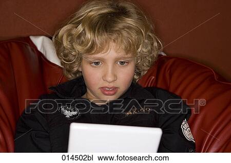 portrait of boy playing computer game View Large Photo Image Stock Image - portrait of boy playing computer game. Fotosearch