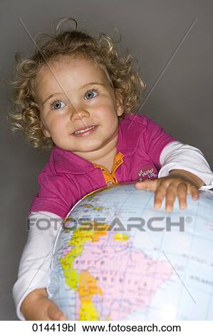 portrait of curly haired toddler playing with globe, Brazil visible View Large Photo Image Stock Image - portrait of curly haired toddler playing with globe, Brazil visible. Fotosearch