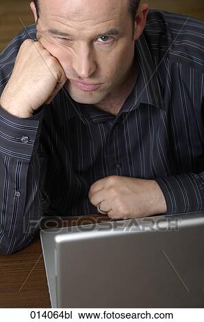 portrait of frustated man with laptop computer View Large Photo Image Stock Image - portrait of frustated man with laptop computer. Fotosearch