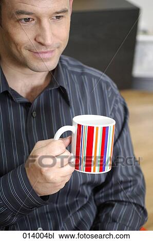 portrait of man having a coffee break at home View Large Photo Image Stock Image - portrait of man having a coffee break at home. Fotosearch