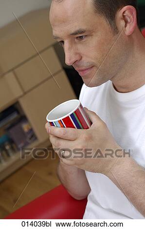 portrait of man having a coffee break at home View Large Photo Image Stock Image - portrait of man having a coffee break at home. Fotosearch